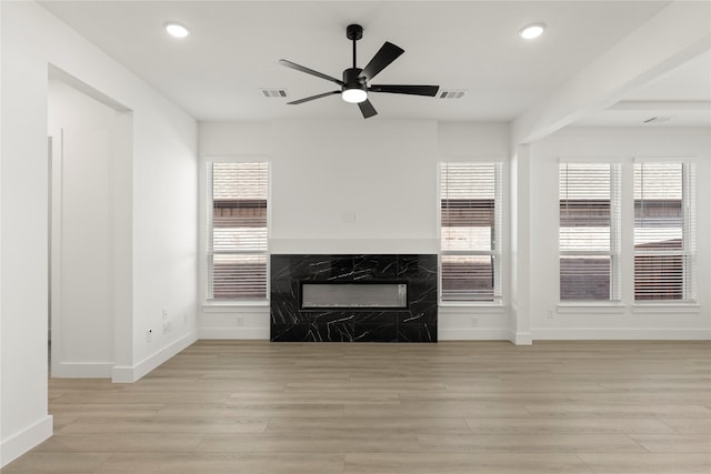 740 Wilderness Point Ln, Anna, TX 75409 - unfurnished living room with ceiling fan, recessed lighting, light wood-style flooring, and a premium fireplace