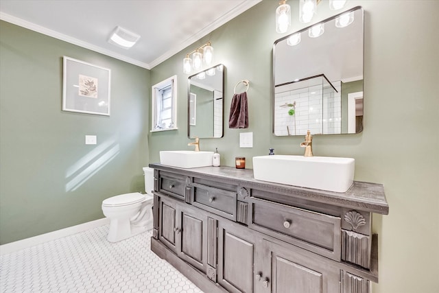 bathroom with tile patterned floors, toilet, vanity, and ornamental molding