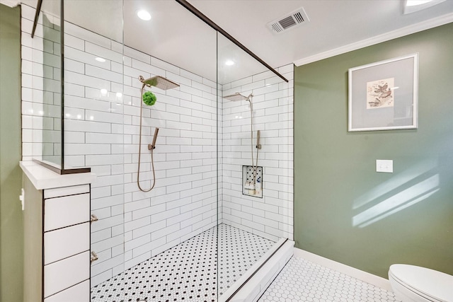 2225 W Park Ave, Corsicana, TX 75110 - bathroom featuring a stall shower, tile patterned floors, toilet, ornamental molding, and recessed lighting