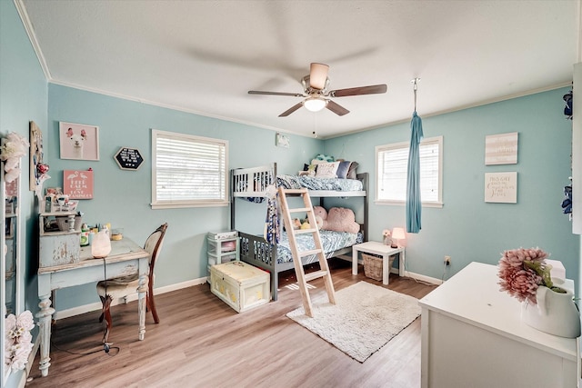 2225 W Park Ave, Corsicana, TX 75110 - bedroom with ornamental molding, wood finished floors, baseboards, and a ceiling fan
