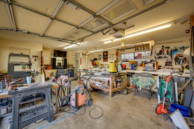 garage featuring a workshop area and a garage door opener