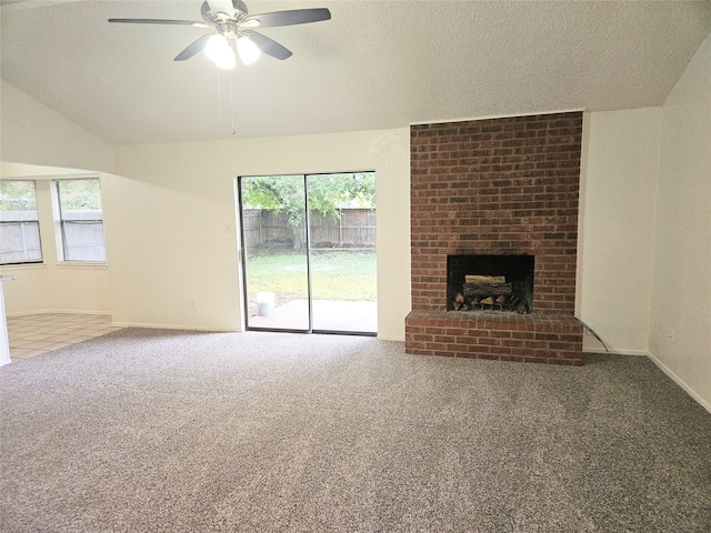 unfurnished living room featuring a fireplace, plenty of natural light, and carpet