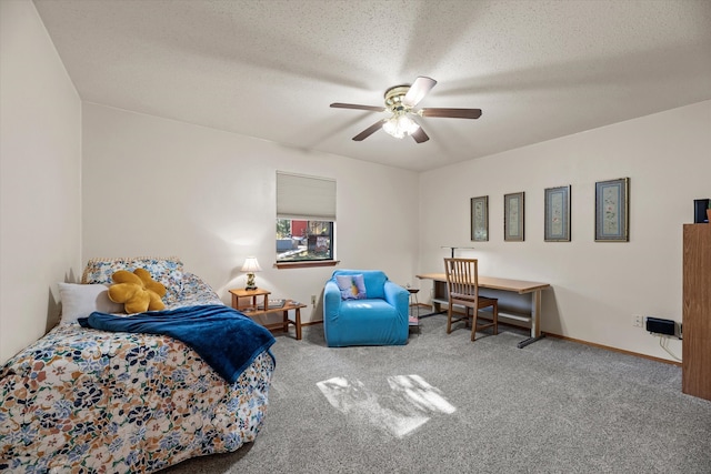 bedroom featuring carpet flooring, a textured ceiling, and ceiling fan