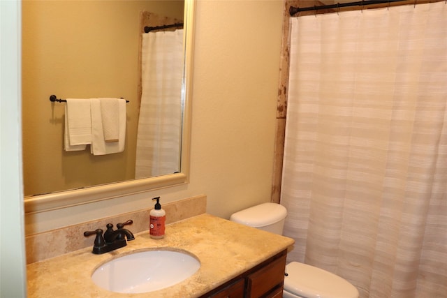 1104 Lynnwood Dr, Cleburne, TX 76033 - full bathroom with vanity, toilet, and a shower with shower curtain
