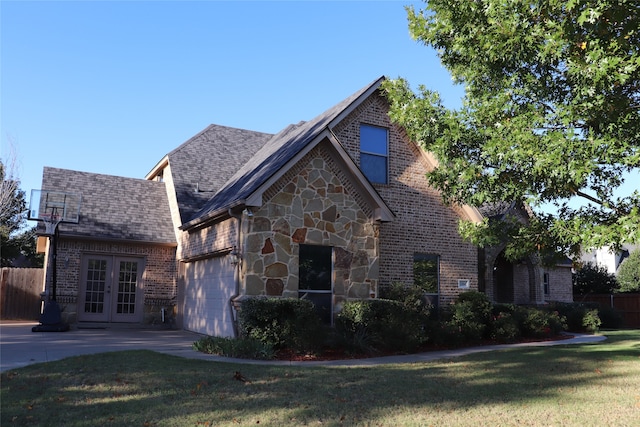 view of front facade featuring french doors and a front yard