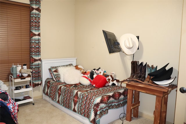 bedroom featuring light carpet