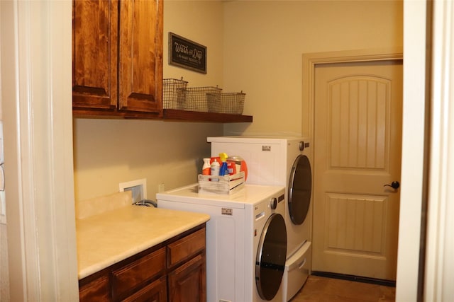 1104 Lynnwood Dr, Cleburne, TX 76033 - laundry room featuring cabinet space, washing machine and dryer, and tile patterned flooring