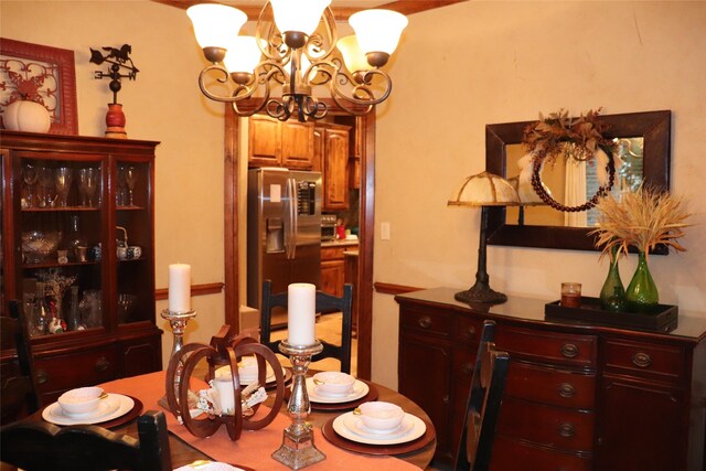 dining space featuring a chandelier