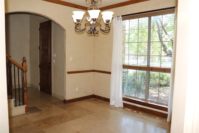 1104 Lynnwood Dr, Cleburne, TX 76033 - empty room featuring arched walkways, a chandelier, and stairway