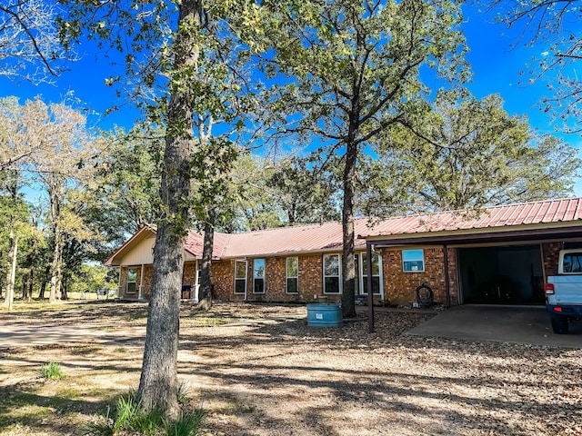 ranch-style home with a carport