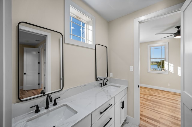 bathroom featuring ceiling fan, vanity, and hardwood / wood-style flooring