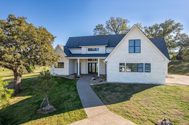 modern farmhouse style home with a front yard