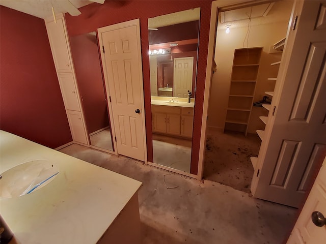 bathroom with vanity and concrete floors