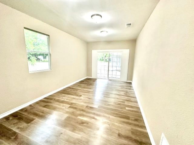 spare room featuring hardwood / wood-style flooring