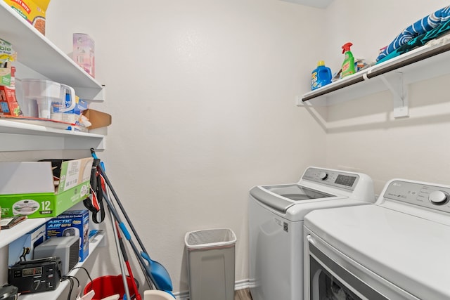 washroom with washing machine and dryer