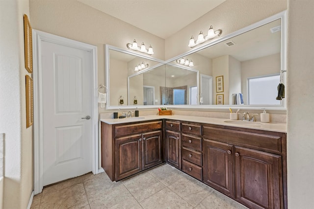 bathroom featuring tile patterned floors and vanity