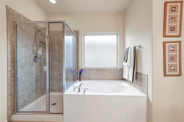 bathroom with shower with separate bathtub