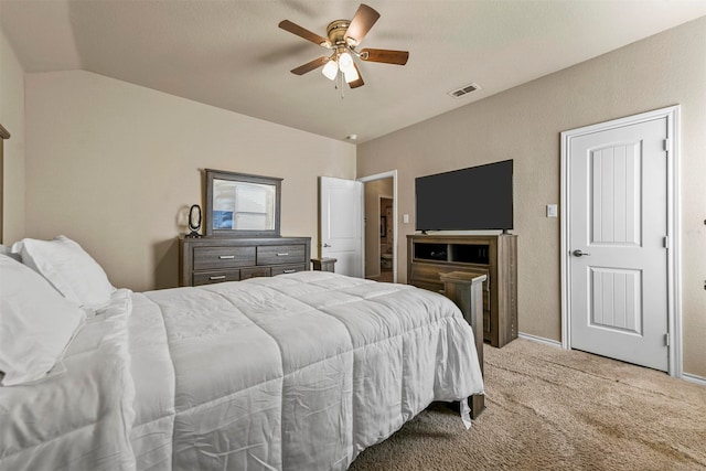 bedroom with ceiling fan, light colored carpet, and lofted ceiling