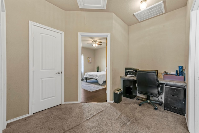 office with light carpet and ceiling fan