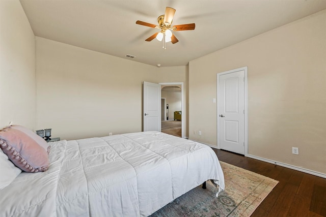 bedroom featuring ceiling fan and dark wood-type flooring