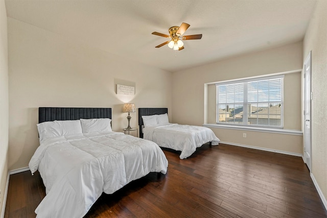 bedroom featuring ceiling fan and dark wood-type flooring