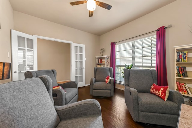 living room with french doors, ceiling fan, and dark wood-type flooring