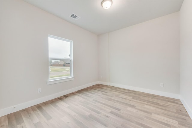 unfurnished room with light hardwood / wood-style flooring