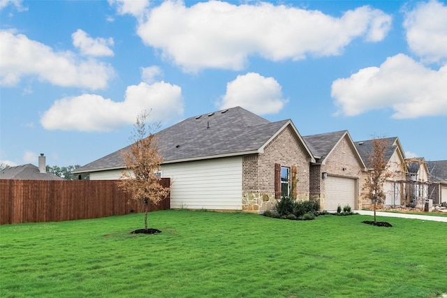 exterior space with a yard and a garage