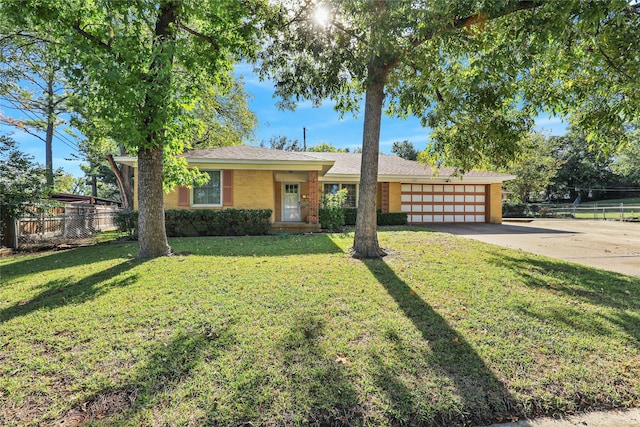 single story home with a front lawn and a garage