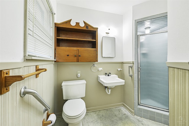 bathroom featuring toilet and walk in shower