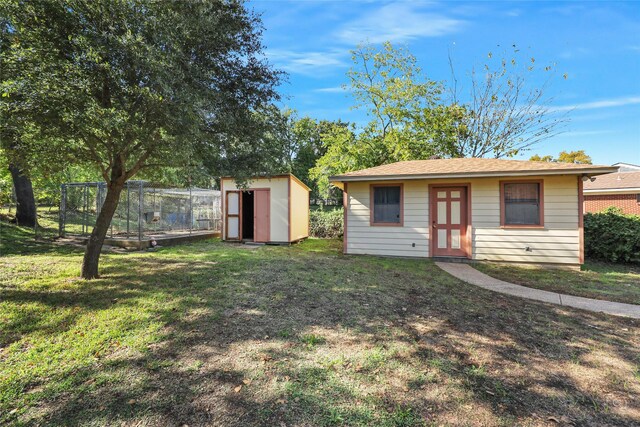 exterior space with an outbuilding and a front yard