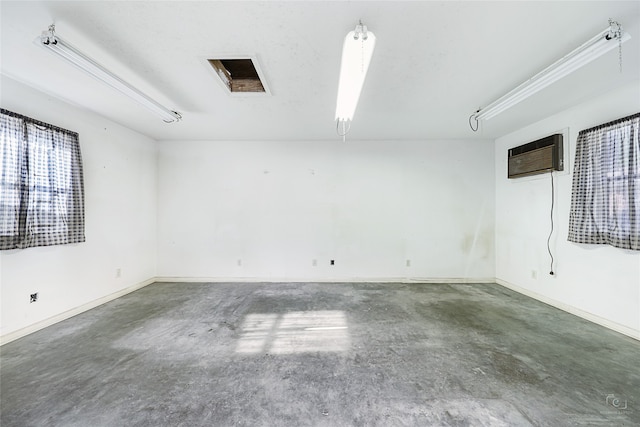 unfurnished room with a wall mounted air conditioner