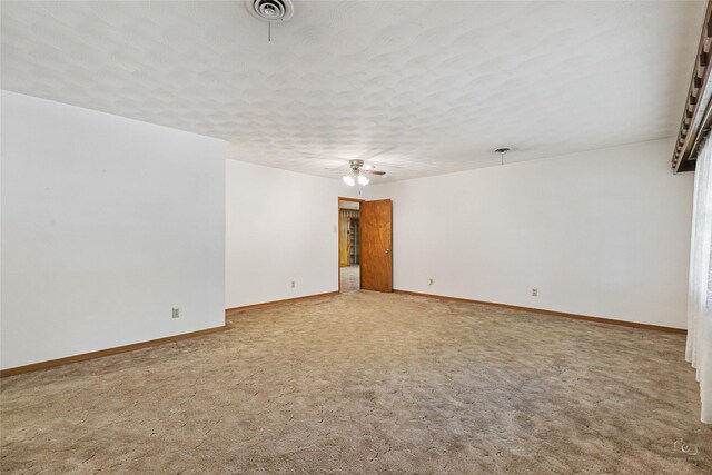 dining room with ceiling fan, wood walls, and a fireplace