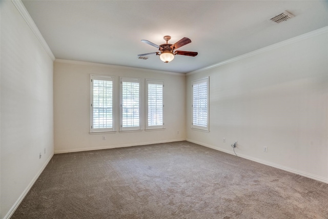 carpeted empty room with ceiling fan and ornamental molding