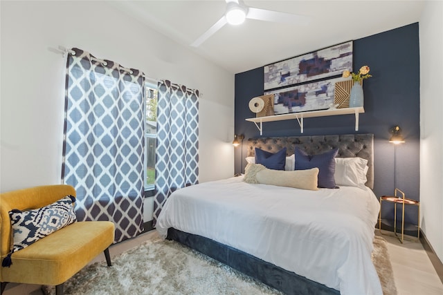 bedroom featuring ceiling fan and hardwood / wood-style floors