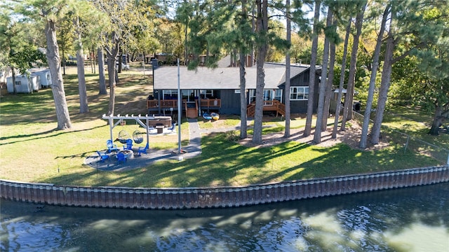 exterior space featuring a patio area, a water view, and an outdoor fire pit