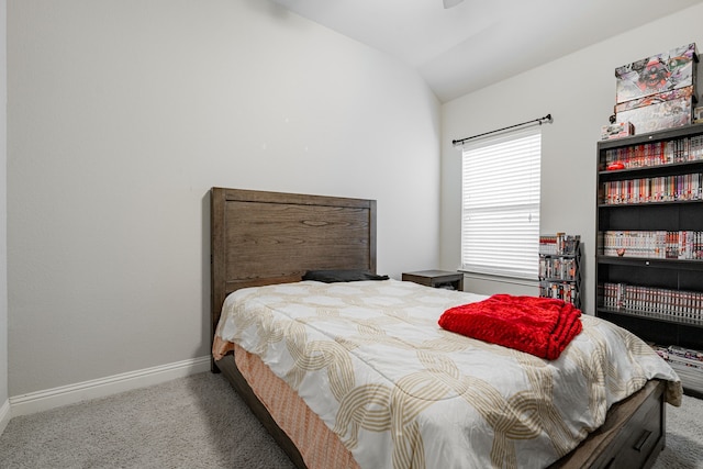 bedroom featuring carpet and vaulted ceiling