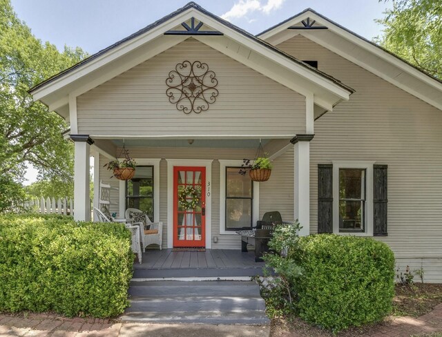 entrance to property with covered porch