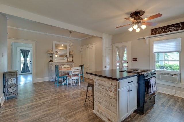 kitchen featuring black electric range, dark hardwood / wood-style flooring, white cabinets, and ceiling fan