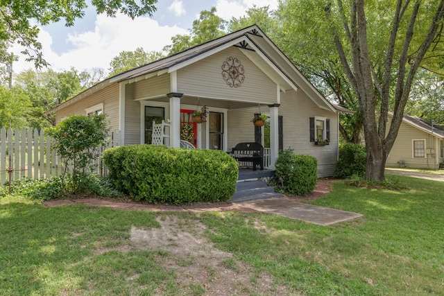 view of front facade with covered porch and a front yard