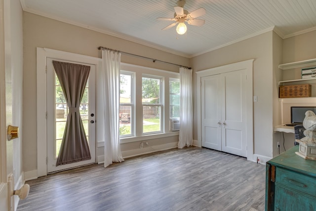 entryway with ceiling fan, ornamental molding, and light wood-type flooring