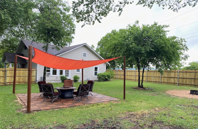 view of yard with an outdoor fire pit and a patio area