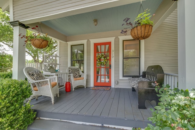 property entrance with covered porch