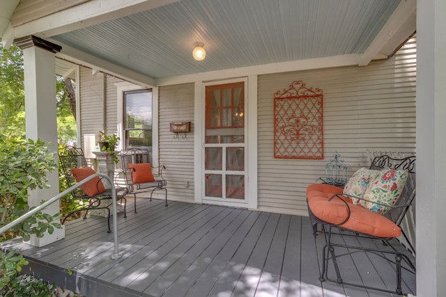 wooden deck featuring a porch