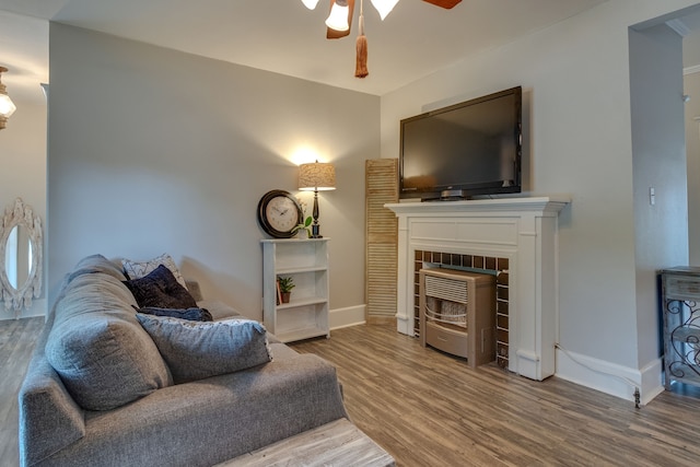 living room featuring ceiling fan and wood-type flooring