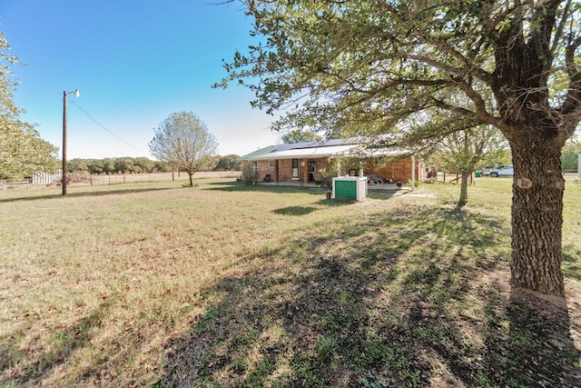 view of yard with a rural view