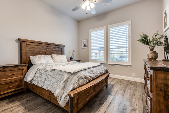 bedroom featuring ceiling fan and dark wood-type flooring