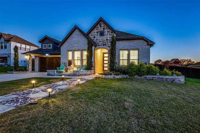 view of front of home with a lawn