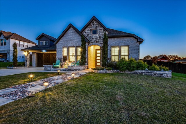 view of front of house with a yard