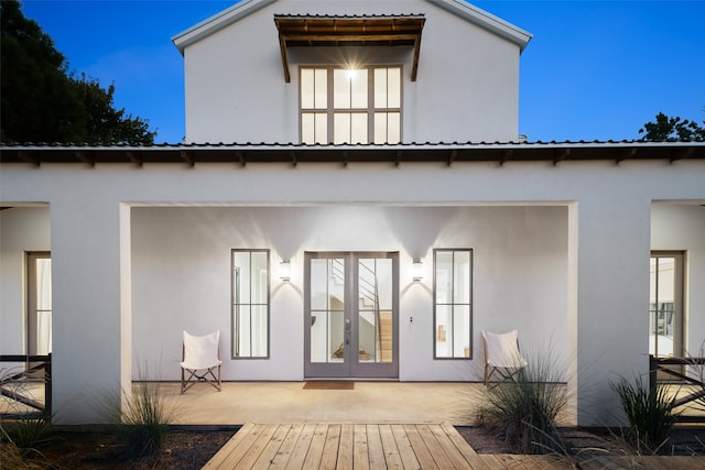 rear view of property featuring a patio area